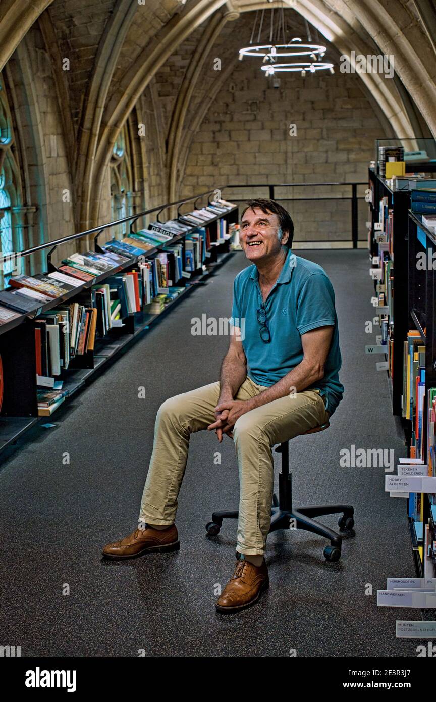 Ton Harmes owner at bookstore Dominicanen`, former medieval church, in Maastricht, Netherlands. Stock Photo